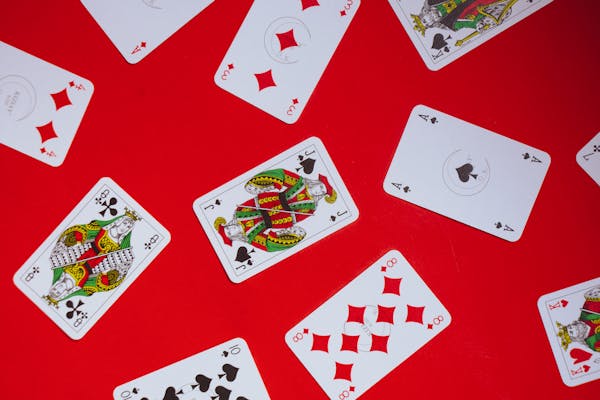 free-photo-of-photograph-of-playing-cards-on-a-red-surface